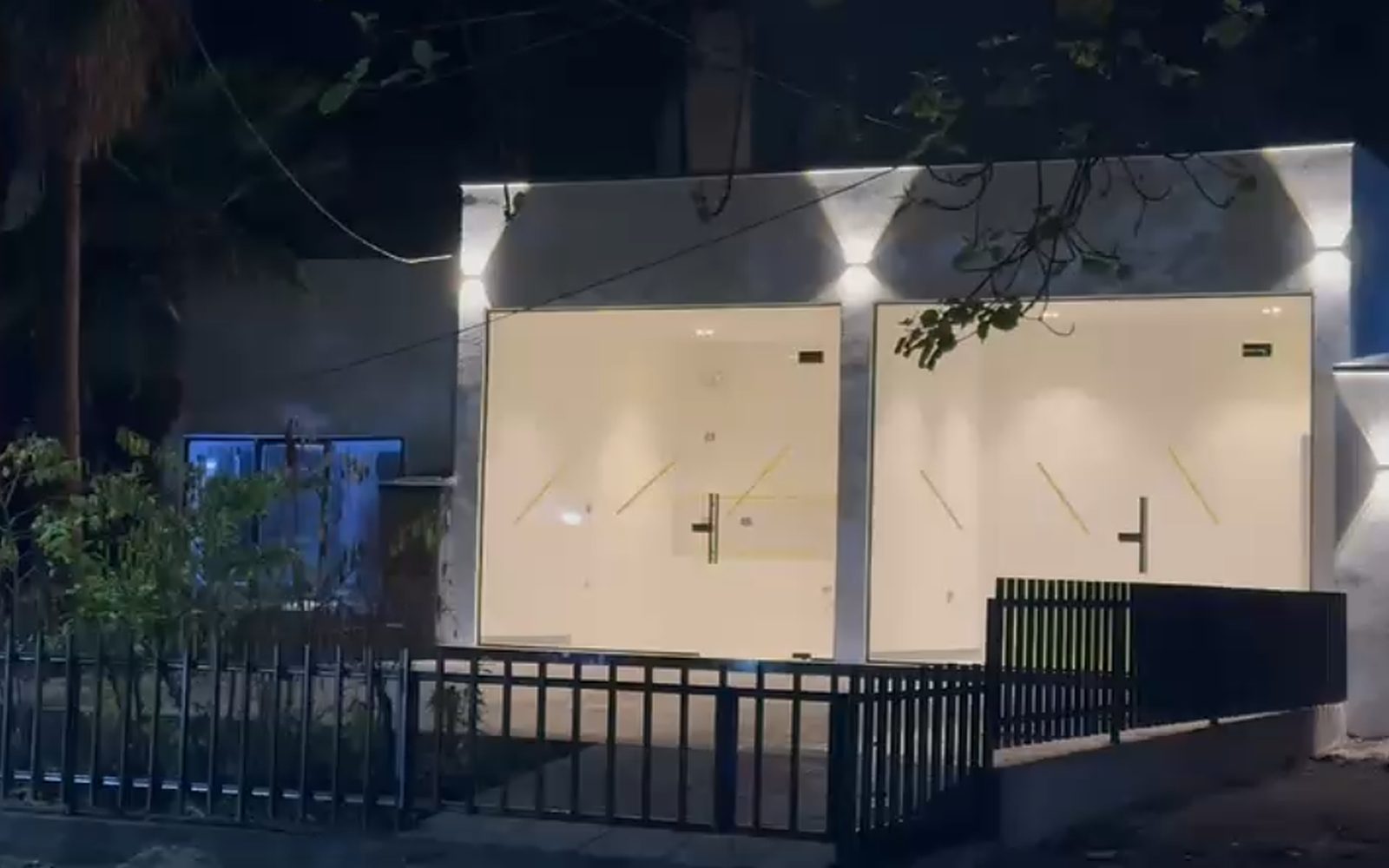 The yard at dusk: Cōlab Press on the left, Cōlab Table on the right